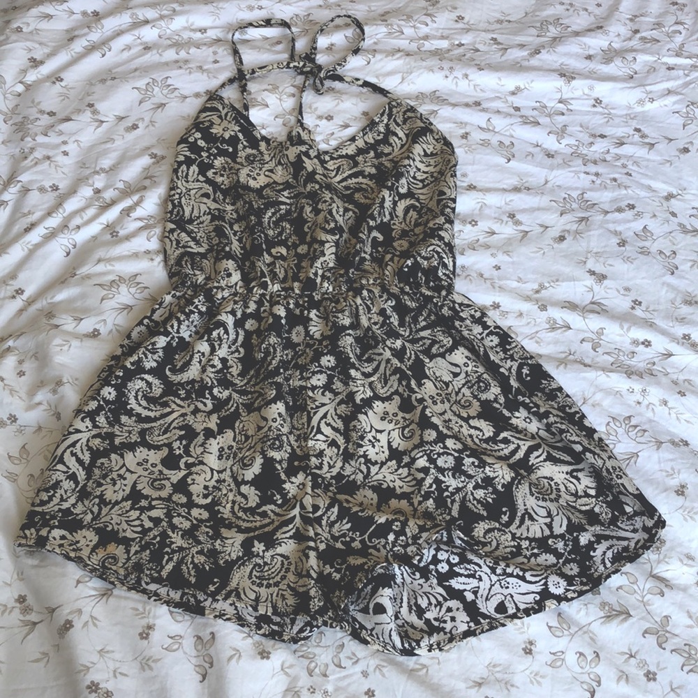 Black and beige colored romper